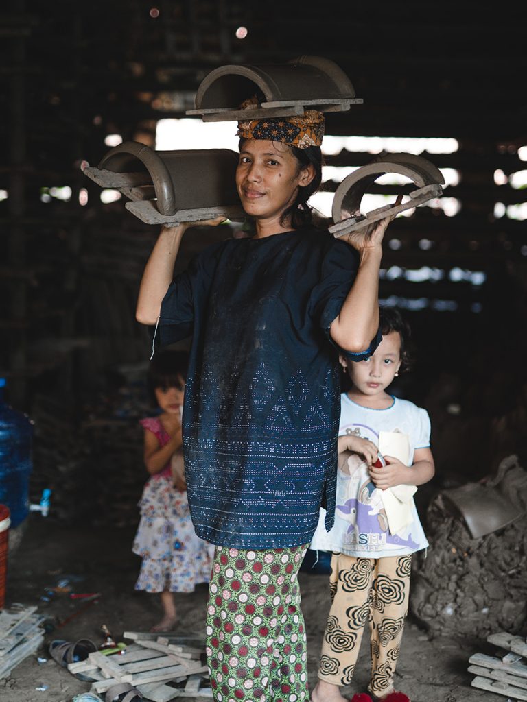 Tile factory worker and her children in Jatiwangi, 2019